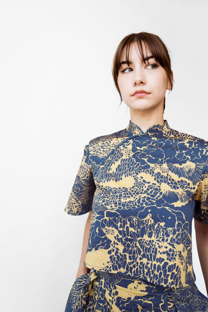 custom qipao top with navy and gold pattern